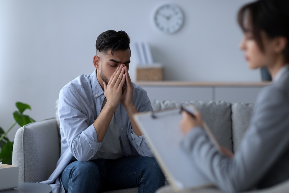 Male speaking to a drug rehab specialist in Louisiana