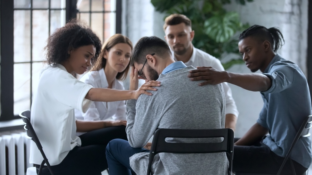 Employee sharing his struggles during group therapy IOP