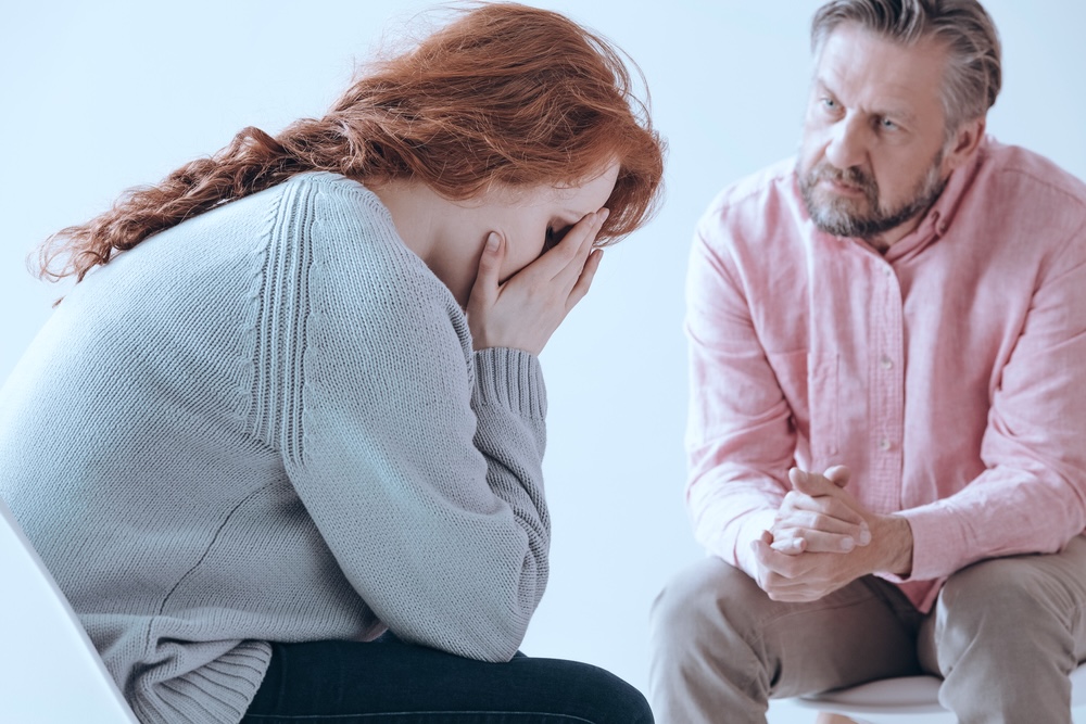 Woman speaking to admissions team of outpatient rehab