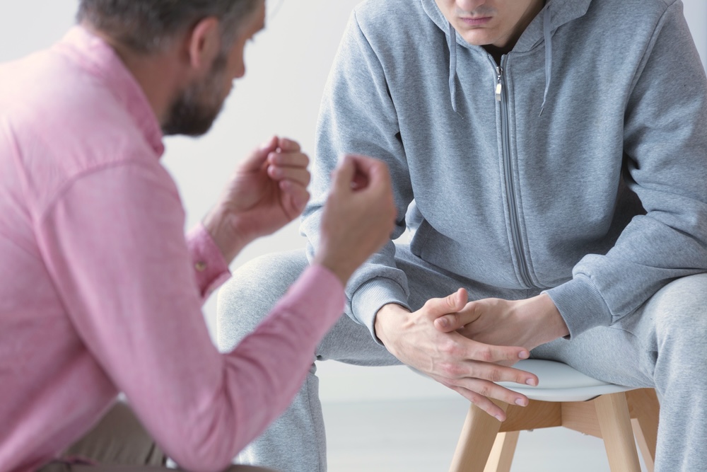 Man experiencing withdrawal symptoms which is a sign you need more than willpower to quit drinking