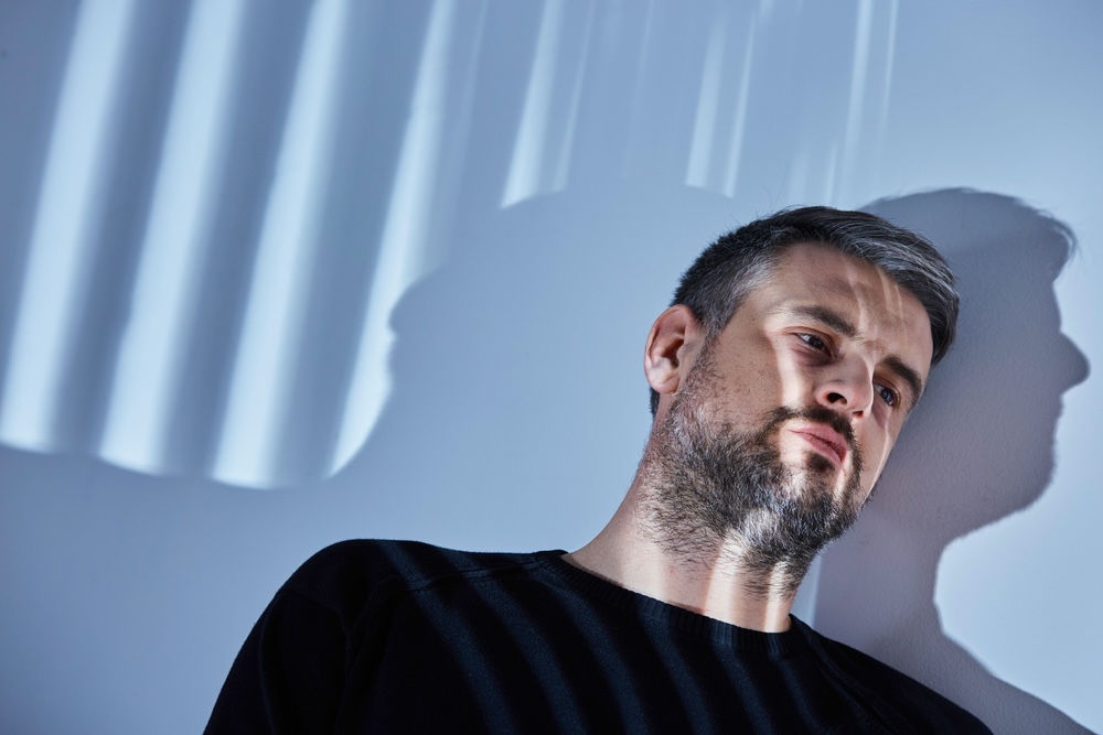 Man struggling with Physical Effects of Long-Term Alcohol Abuse